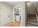 Functional laundry area with convenient storage, a modern washer, and easy access to the stairs at 4246 N Mountain Ne Rd, Marietta, GA 30066