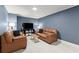 Cozy living room features leather sofas and a large screen television, perfect for entertaining at 4246 N Mountain Ne Rd, Marietta, GA 30066
