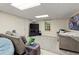 Finished basement living room with plush seating and TV area at 4246 N Mountain Ne Rd, Marietta, GA 30066