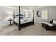 Spacious main bedroom with a four-poster bed, plush carpet, and elegant decor for a comfortable retreat at 4246 N Mountain Ne Rd, Marietta, GA 30066
