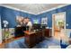 Well-appointed office with blue walls, wood trim, and a view of the kitchen at 4246 N Mountain Ne Rd, Marietta, GA 30066