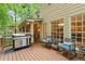 Cozy outdoor patio with a built-in grill, comfortable rocking chairs, and serene views at 4246 N Mountain Ne Rd, Marietta, GA 30066