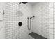 Walk-in shower features subway tiles, a shower bench, and black matte hardware at 4246 N Mountain Ne Rd, Marietta, GA 30066