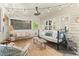 Relaxing sunroom includes cozy furniture, charming decor, and natural light for a serene ambiance at 4246 N Mountain Ne Rd, Marietta, GA 30066