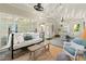 Versatile sunroom offers a blend of seating areas, a dining table, and elegant accents for entertaining at 4246 N Mountain Ne Rd, Marietta, GA 30066