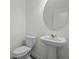 Powder room features a pedestal sink, stylish mirror, and tiled floors at 436 Corricella Ct, Mcdonough, GA 30253