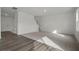 Open-concept living room with luxury vinyl plank flooring at 436 Corricella Ct, Mcdonough, GA 30253