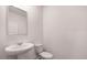 Bathroom with pedestal sink and toilet at 11408 Gray Branch Dr, Lawrenceville, GA 30045