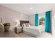 Cozy bedroom showcasing a stylish bed, bedside table, and vibrant curtains, creating a comfortable and inviting space at 11408 Gray Branch Dr, Lawrenceville, GA 30045