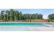 Community pool with fences and lounge area at 11408 Gray Branch Dr, Lawrenceville, GA 30045