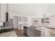 Bright kitchen features a central island with stainless appliances, granite countertops, and an open layout at 11408 Gray Branch Dr, Lawrenceville, GA 30045
