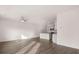Open-concept living room features hardwood floors, ceiling fan, and recessed lighting at 11408 Gray Branch Dr, Lawrenceville, GA 30045