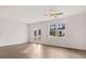 Bright living room with hardwood floors, large windows, and glass doors to patio at 11408 Gray Branch Dr, Lawrenceville, GA 30045