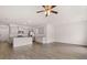 Open-concept living room seamlessly connects to the modern kitchen with sleek countertops and stainless steel appliances at 11408 Gray Branch Dr, Lawrenceville, GA 30045