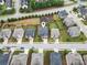 An aerial view displays a beautiful home in a suburban community with a neighborhood park at 212 Jetta Cir, Mcdonough, GA 30253