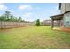 Expansive backyard with lush green lawn and wood fence, ideal for outdoor activities at 212 Jetta Cir, Mcdonough, GA 30253