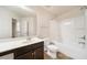 Well-lit bathroom with a shower and tub, a spacious vanity, and tiled floors at 212 Jetta Cir, Mcdonough, GA 30253