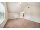 A well-lit bedroom features plush carpeted floors and multiple doors for easy access and flow at 212 Jetta Cir, Mcdonough, GA 30253