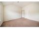 A large bedroom provides comfort with soft carpeted floors and a bright, airy ambiance at 212 Jetta Cir, Mcdonough, GA 30253