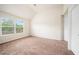 Bedroom with carpeted floors, a high ceiling, and a window showcasing a playground outside at 212 Jetta Cir, Mcdonough, GA 30253