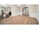 Spacious dining room boasts arched doorways and decorative wainscotting, creating an elegant entertaining space at 212 Jetta Cir, Mcdonough, GA 30253