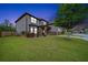 Beautiful two-story home at dusk, showcasing manicured lawn and inviting exterior lighting at 212 Jetta Cir, Mcdonough, GA 30253