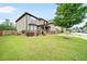 Charming two-story home with well-maintained lawn and mature tree in a suburban neighborhood at 212 Jetta Cir, Mcdonough, GA 30253