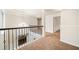 A beautifully decorated hallway features a chandelier, carpeted floors and a lovely stairway at 212 Jetta Cir, Mcdonough, GA 30253