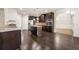 Modern kitchen boasts dark cabinetry, stainless steel appliances, and a functional center island, enhancing its appeal at 212 Jetta Cir, Mcdonough, GA 30253