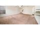 Spacious living room with carpeting, a staircase, and granite-topped counter offering both comfort and convenience at 212 Jetta Cir, Mcdonough, GA 30253