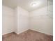 Spacious walk-in closet featuring shelving and neutral carpet for easy organization at 212 Jetta Cir, Mcdonough, GA 30253