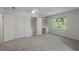 Bright bedroom features neutral carpet, built in shelving, and a large window at 4220 Singing Post Ne Ln, Roswell, GA 30075