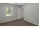 Cozy bedroom featuring carpeted floor, a window and a closet at 4220 Singing Post Ne Ln, Roswell, GA 30075