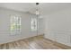 Bright dining room with hardwood flooring, neutral paint, two windows and plantation shutters at 4220 Singing Post Ne Ln, Roswell, GA 30075