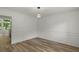 Bright dining room with hardwood flooring, neutral paint and white trim at 4220 Singing Post Ne Ln, Roswell, GA 30075
