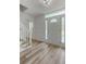 Inviting foyer with decorative glass features and adjacent staircase creates a warm entry at 4220 Singing Post Ne Ln, Roswell, GA 30075