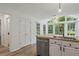 Open kitchen with stainless appliances, wooden countertops, and a view to the spacious breakfast area at 4220 Singing Post Ne Ln, Roswell, GA 30075