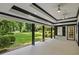 Covered patio featuring brick flooring, pillars and a view of the backyard at 4220 Singing Post Ne Ln, Roswell, GA 30075