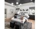 Bright bedroom with a decorative ceiling, lots of windows, a couch and carpet on the floor at 6450 Pond View Dr, Cumming, GA 30028