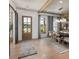 Inviting entryway flows into the dining room with hardwood floors and lots of natural light at 6450 Pond View Dr, Cumming, GA 30028