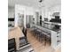Modern kitchen with stainless steel appliances, a large island with seating, and a walk-in pantry at 6450 Pond View Dr, Cumming, GA 30028
