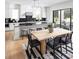 Modern kitchen with a large island, stainless steel appliances, breakfast bar and access to the patio at 6450 Pond View Dr, Cumming, GA 30028