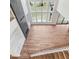 Open-concept living area with tall windows, fireplace, and staircase at 6450 Pond View Dr, Cumming, GA 30028