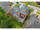 An aerial view showcases the home's expansive deck and manicured landscaping at 952 Moores Walk Ln, Suwanee, GA 30024