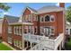 Stunning brick home features a spacious deck perfect for outdoor entertaining and relaxation at 952 Moores Walk Ln, Suwanee, GA 30024