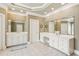 Bright bathroom featuring tile floors, white cabinets, and a double sink vanity with lots of counter space at 952 Moores Walk Ln, Suwanee, GA 30024