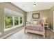 Comfortable bedroom with large windows that let in lots of natural light at 952 Moores Walk Ln, Suwanee, GA 30024
