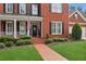 Close up of the front exterior of the home showing the brick walkway and landscaped front yard at 952 Moores Walk Ln, Suwanee, GA 30024