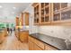 Gourmet kitchen features granite countertops, stainless appliances, and custom cabinetry at 952 Moores Walk Ln, Suwanee, GA 30024