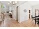 Spacious living area with high ceilings, hardwood floors, large windows, and ample natural light at 952 Moores Walk Ln, Suwanee, GA 30024